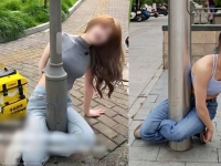 다리로 가로등 감싸는 게 유행?…"안 풀려요" 경찰 출동 소동까지