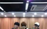 JYJ members pose in track suits 