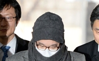 [포토]고개숙인 채 법원 출석한 이재현 회장