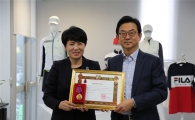 휠라코리아, 라오스 대통령 훈장 받아
