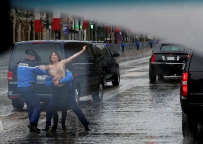 상반신 알몸 여성, 트럼프 차량에 접근 시위