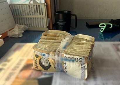 띠지로 주인 찾았다…아파트화단 7500만원은 재개발 보상금이었다