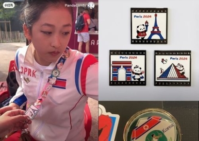 韓 언론 외면한 북한 선수…외국인들과는 배지 교환에 셀카까지