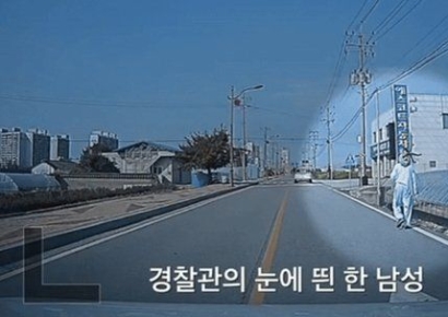 폭염에 링거 꽂고 '터벅터벅'…찻길 걷던 노인, 무슨 일