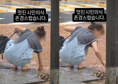 쪼그려 앉아 맨손으로 침수 도로 하수구 치운 시민…"존경합니다" 찬사