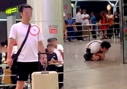 베트남 공안에 잡히자 무릎 꿇고 오열한 남성…티셔츠엔 태극기가