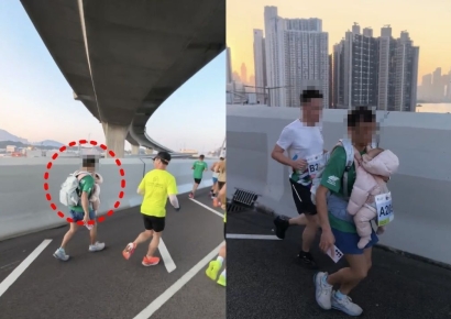 "갓난아기 머리가 위 아래로 흔들리는데…"…아기 안고 뛴 홍콩 마라톤 참가자 '논란'