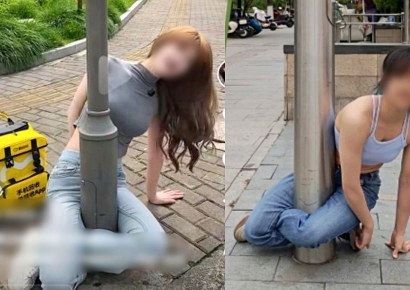 "왜 이러는 거야?" 다리로 가로등 감싸는 '황당 챌린지'…경찰 출동 소동까지