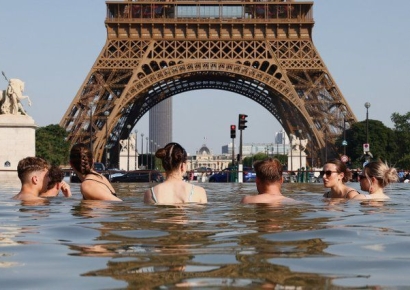 Heatwave Sweeps Europe: Eiffel Tower and Louvre Shorten Operating Hours in France